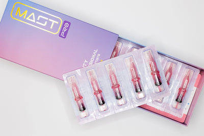 Open box displaying six sealed syringes in individual plastic holders, designed for use with a specific electronic device. The box is labeled "Dragonhawk" and has a gradient purple and pink design. This special edition, featuring MAST PRO SE UNIVERSAL NEEDLE CARTRIDGE (3RL), ensures precision and quality.